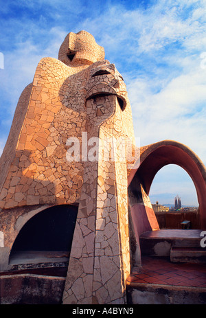 Spain, Barcelona Catalunya Gaudi or Antoni Gaudi or Antoni Gaudi i Cornet. La Pedrera or Casa Mila. Roof view of Sagrada Familia. Modernism architecture Stock Photo