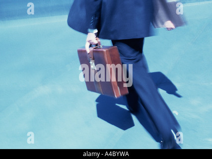 USA New York City NYC Businessman Well Dressed With a Briefcase Walking in the Street in a Hurry Stock Photo