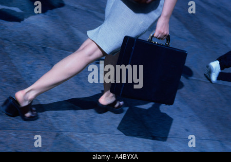 Businesswoman walking carrying a briefcase New York City Stock Photo