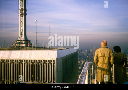 Taking in the view at the top of the World Trade Center matching duplicate double match pair partner spitting image Stock Photo