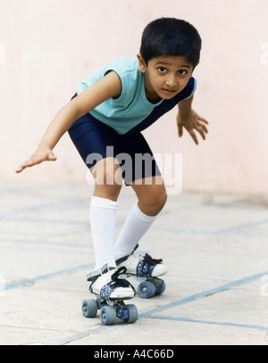 A little boy on roller skates Stock Photo