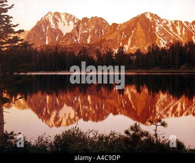 Frog Lake at sunrise with Castle Peak reflected in the still waters in the Sawtooth National Recreation Area in Idaho Stock Photo