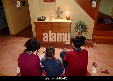 Family at evening prayer Stock Photo