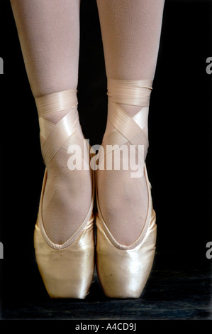 close up of a ballerina's foot on points in ballet shoes Stock Photo