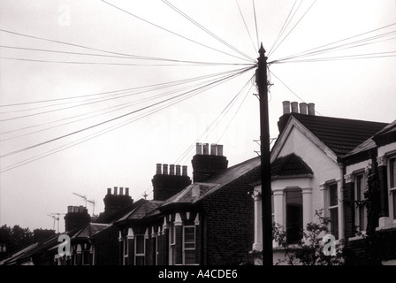 Lines leading away from telephone pole London England UK Stock Photo
