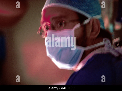 A doctor looks stressed during surgery Stock Photo