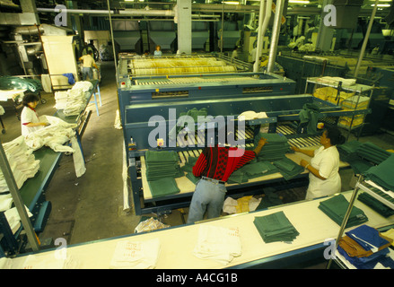 Laundry staff at work in the hospital laundry at Whipps Cross Hospital, London Stock Photo