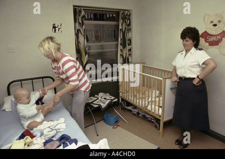 askham grange women jail inmate enjoying time with her baby under the vigilance of a woman prison officer Stock Photo