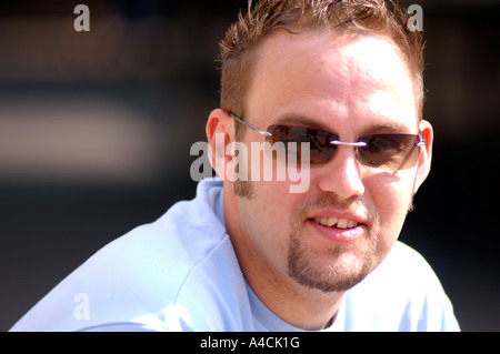Royalty free photograph of young man British college university teacher portrait London UK self employed in urban location Stock Photo