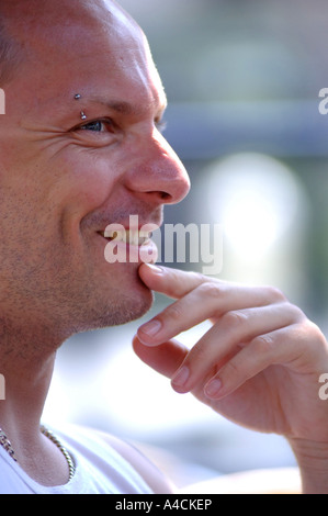 Royalty free photograph of British college university student socializing and laughing in profile at a London cafe UK Stock Photo