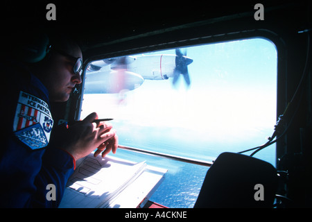 Iceberg Observer on USCG International Ice Patrol HC130 Hercules St Johns Newfoundland April 2001 Stock Photo