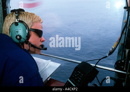 Iceberg Observer on USCG International Ice Patrol HC130 Hercules St Johns Newfoundland April 2001 Stock Photo