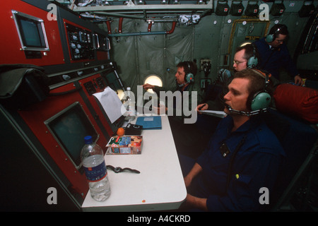 Radar sensor operators on USCG International Ice Patrol HC130 Hercules look for icebergs in the North Atlantic Stock Photo