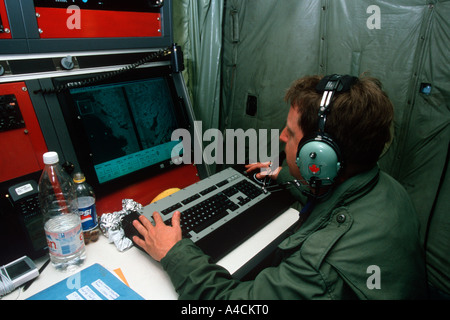 Radar sensor operators on USCG International Ice Patrol HC130 Hercules look for icebergs in the North Atlantic Stock Photo