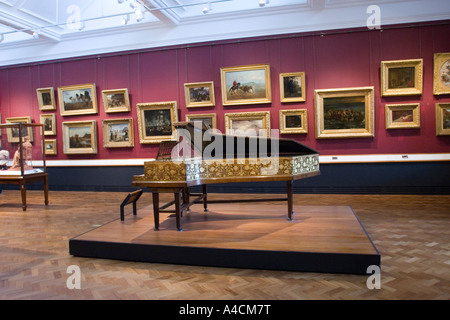 Art Gallery with paintings and grand piano in the V&A Victoria and Albert Museum, South Kensington London GB UK Stock Photo