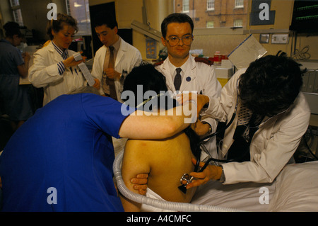 Medical staff attend to a patient in the Intensive Care Unit of Guy’s Hospital, London, England Stock Photo