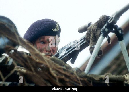 British army cadet mans machine gun during demo at Martham carnival fete in the 1990s Stock Photo