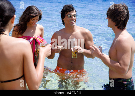 Group of friends in water having fun Stock Photo