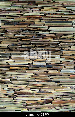 A stone wall constructed from various pieces of rock Stock Photo
