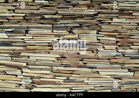 A stone wall constructed from various pieces of rock Stock Photo
