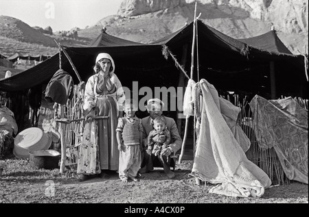 July 1987 Iraq Turkey border Kurdistan A Kurdish family outside their tent at summer mountain pasture Stock Photo