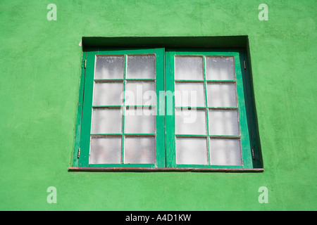 Green painted window and wall of a traditional building, Havana, La Habana Vieja, Cuba Stock Photo
