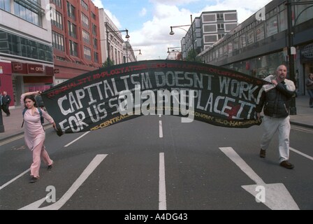 Anti globalisation protesters march through the centre of London, UK, May day 2002 Stock Photo