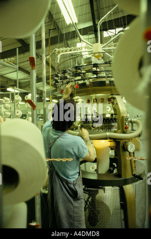 An inmate working on machinery at Featherstone Prison, UK Stock Photo