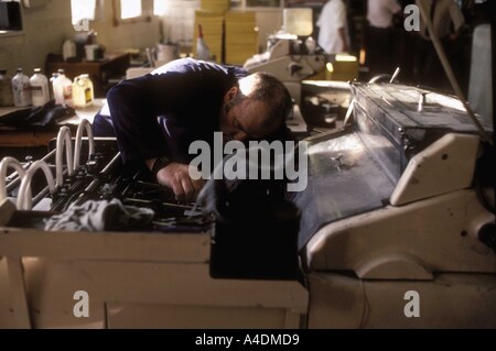 Leyhill open prison, an inmate working on a textile machine Stock Photo