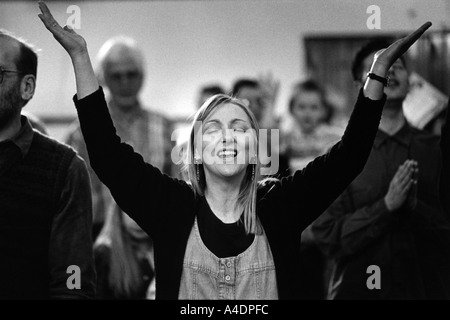 Congregation at Ash Hill in Norfolk praying to be 'touched by the Holy Spirit'. The 'Fountain of Life' evangelical congregation Stock Photo