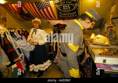 A man and a woman at stall selling clothing memorabilia, Festival of Country Music, Wembley,  1991 Stock Photo