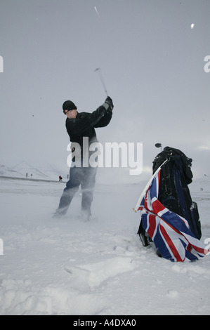 Jason Nichols teeing off on the ice at the 2004 Drambuie ice golf championship in norway Stock Photo