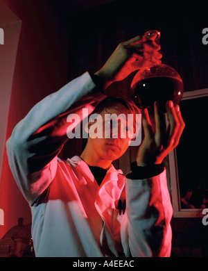Technician looking at a sample in a laboratory Stock Photo