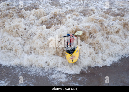 kayaker paddling in whitewater on the animas river, durango, colorado