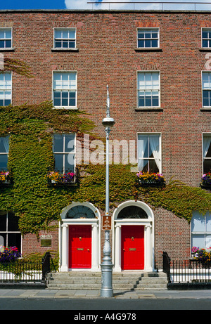 The most famous aspect of the Georgian houses of Dublin Ireland are the doors painted in bright colours- Fitzwilliam Square Stock Photo