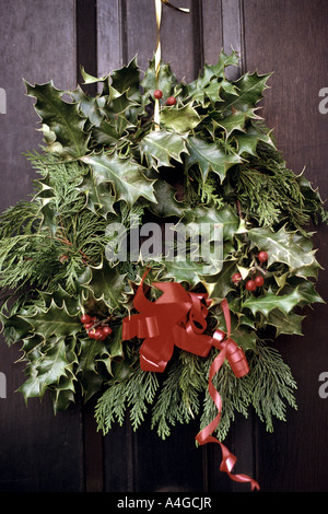 Christmas wreath on a front door of a house Stock Photo