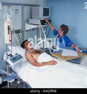 Male nurse with a patient in the intensive care unit Stock Photo - Alamy