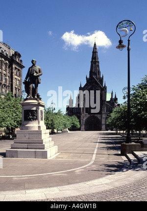 Blue sky sunny day at Glasgow Cathedral and The Precinct with statue of David Livingstone Scotland UK Stock Photo