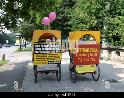 love on the run Rickshaw on tour with customers holding hands Munich Bavaria Germany