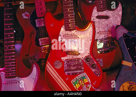 Various vintage guitars on stage at an alternative club in Jacksonville Florida USA Stock Photo