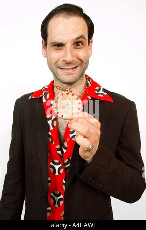 A sleazy looking man gesturing to camera Stock Photo