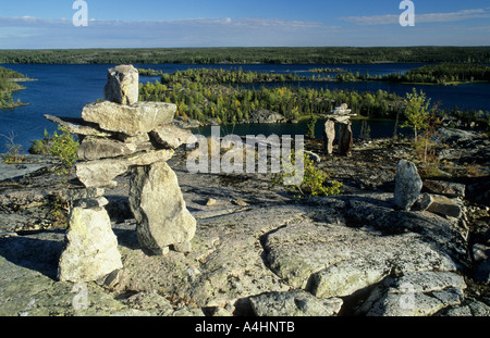 Cairn or stone man or inukshuk at the Hidden Lakes, Ingraham Trail, Northwest Territories, Canada Stock Photo