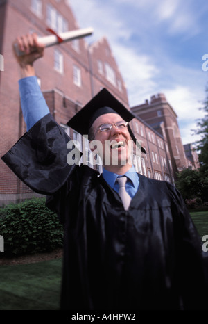 Celebrating Caucasian graduate Stock Photo