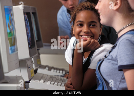 Students in middle school computer lab working on problem Stock Photo