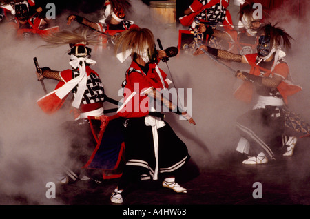 Japanese Tsugaru Shamisen Players and Dancers from Japan performing and dancing Traditional Sword Dance of Demons on Stage Stock Photo