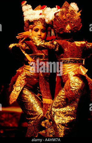 Legong Dancers - Young Balinese Girls dancing Classical Dance Performance and wearing Traditional Costume from Bali, Indonesia Stock Photo