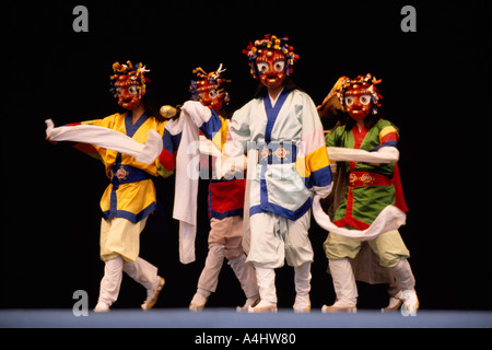 Performers from the Pongsan Mask Dance Drama Troupe from Korea performing on Stage Stock Photo