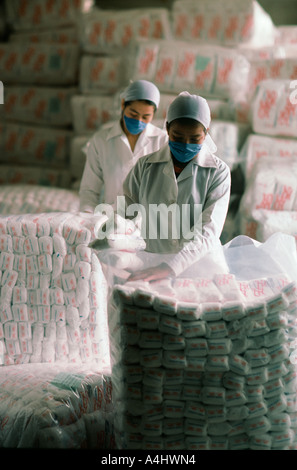 Mexican warehouse workers packaging sugar Stock Photo