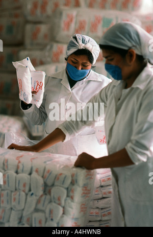 Mexican warehouse workers packaging sugar Stock Photo