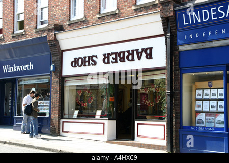 Barber Shop with upside down sign Winchester Stock Photo